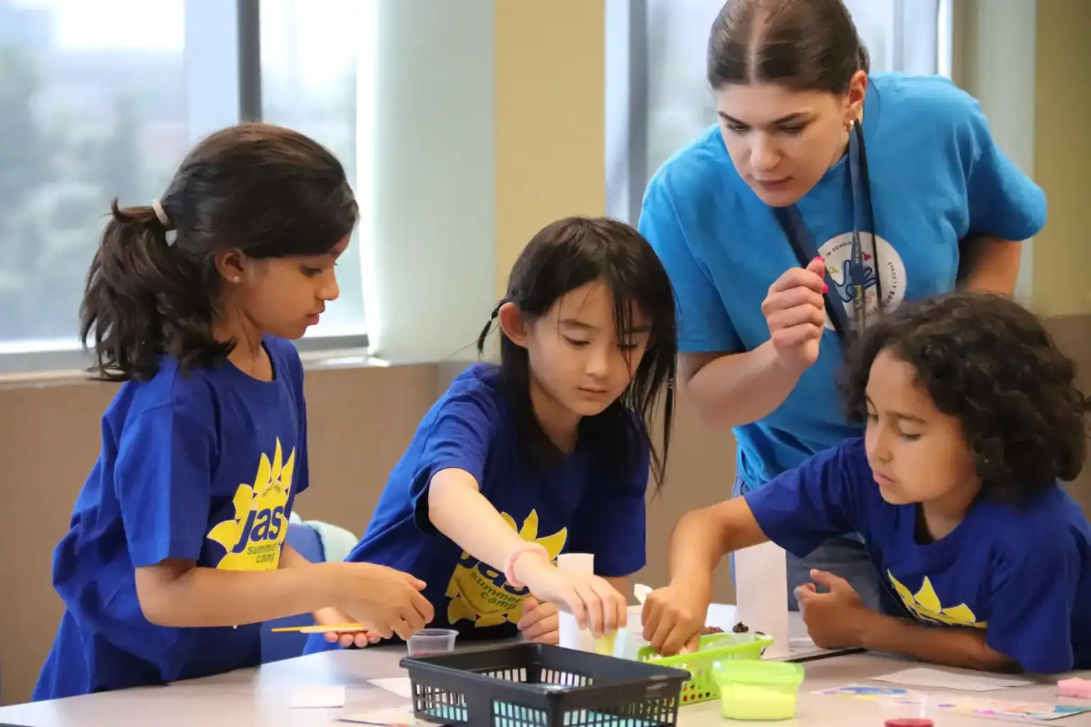 Engaging students in hands-on activities at a world schools summer camp.