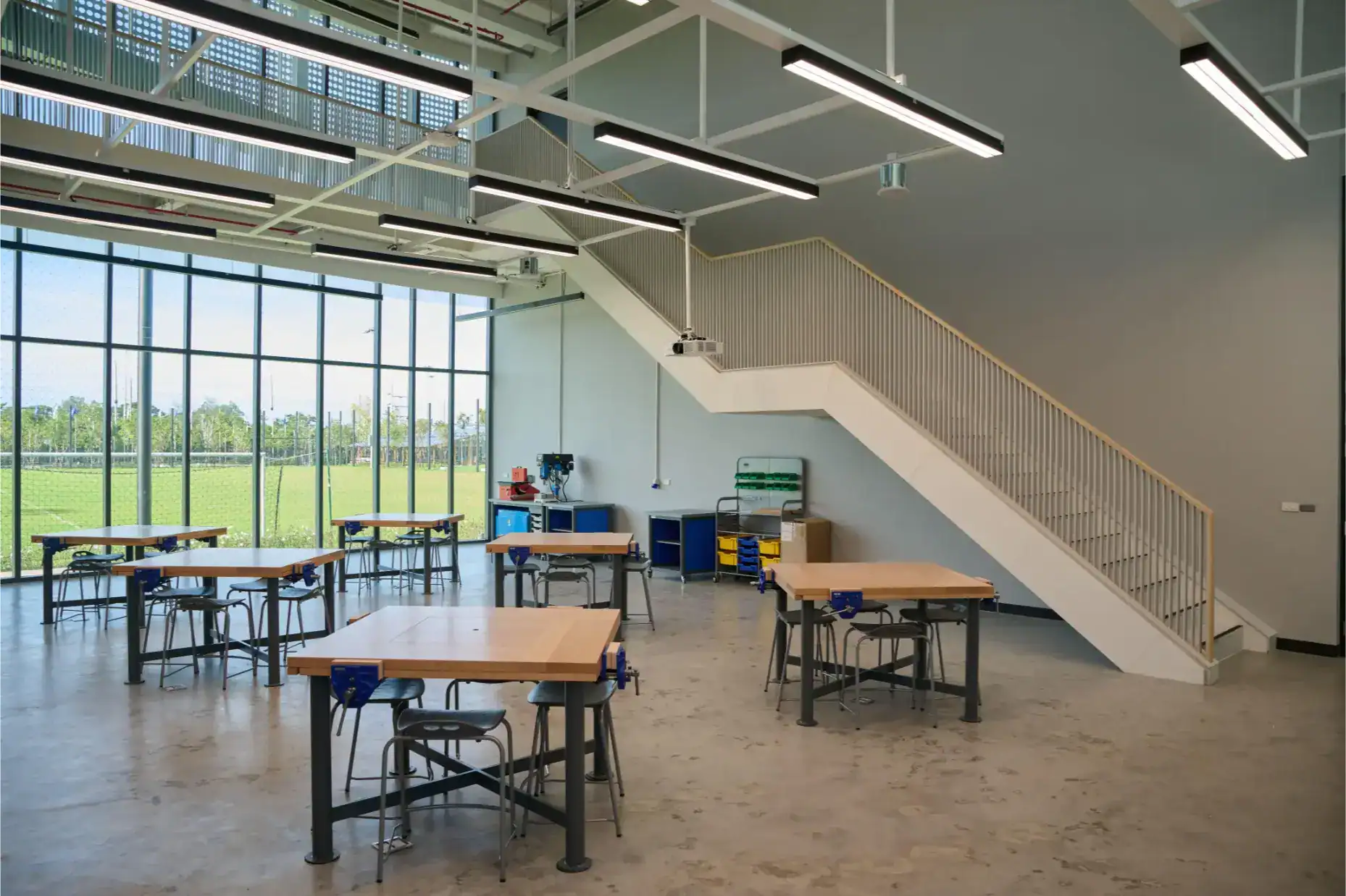 Modern school science classroom with large windows, STEM equipment, and spacious layout for student learning.