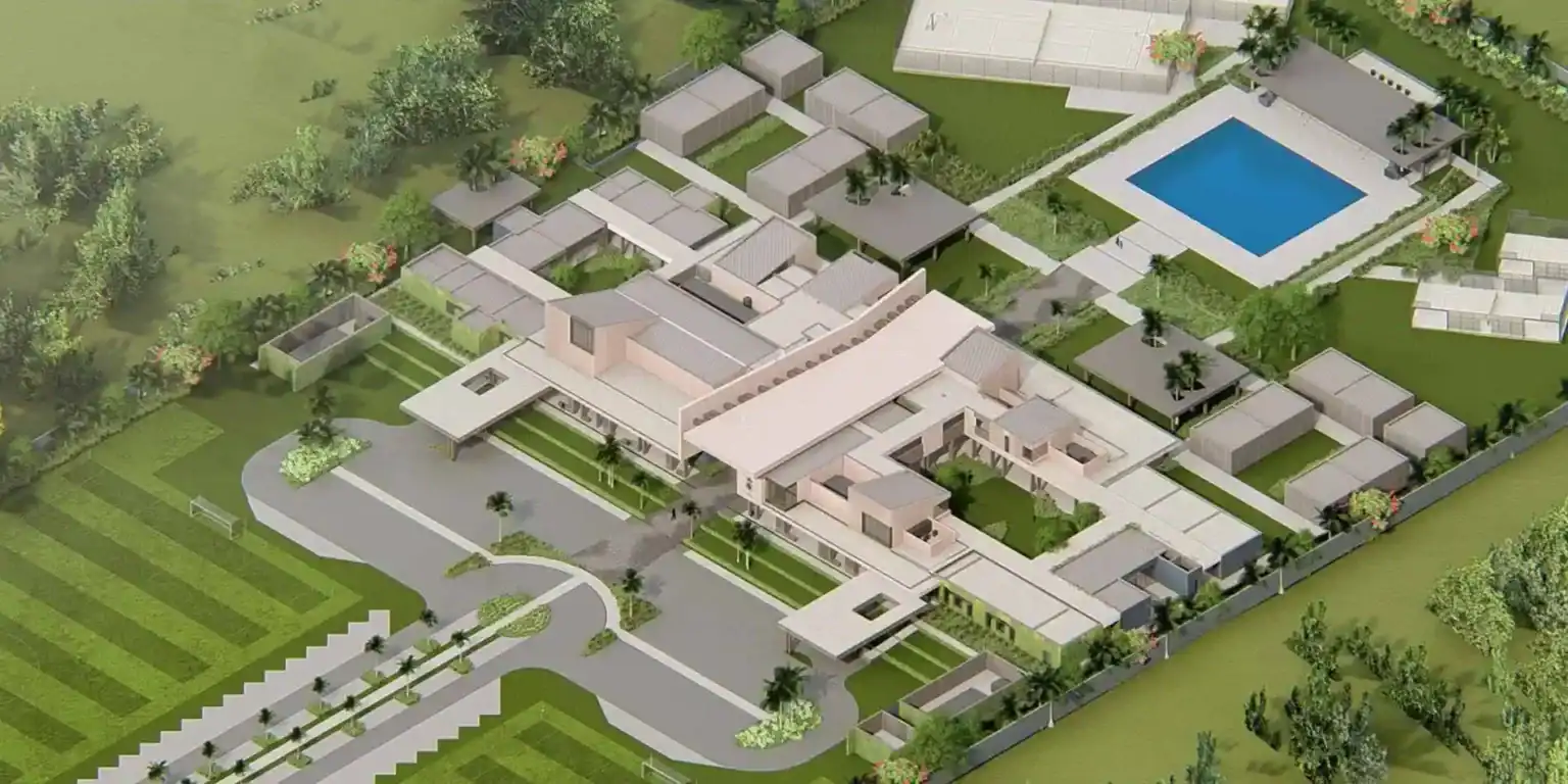 Modern international school campus with lush greenery and swimming pool for diverse student activities.