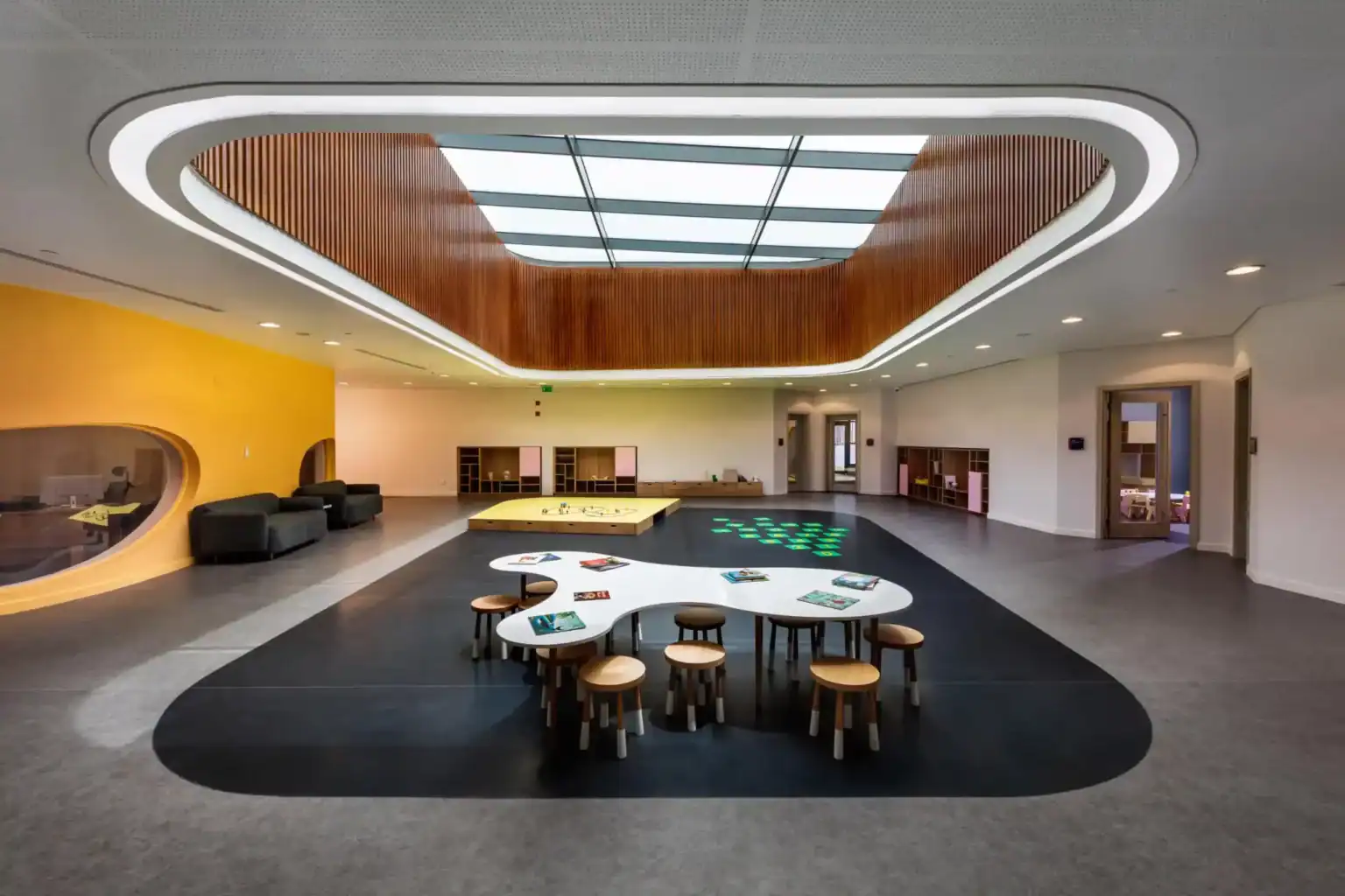 Bright modern school interior with flexible learning spaces and creative design for students.