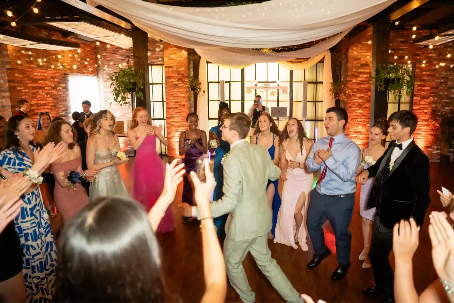 Elegant school prom celebration with students dancing and enjoying the event.