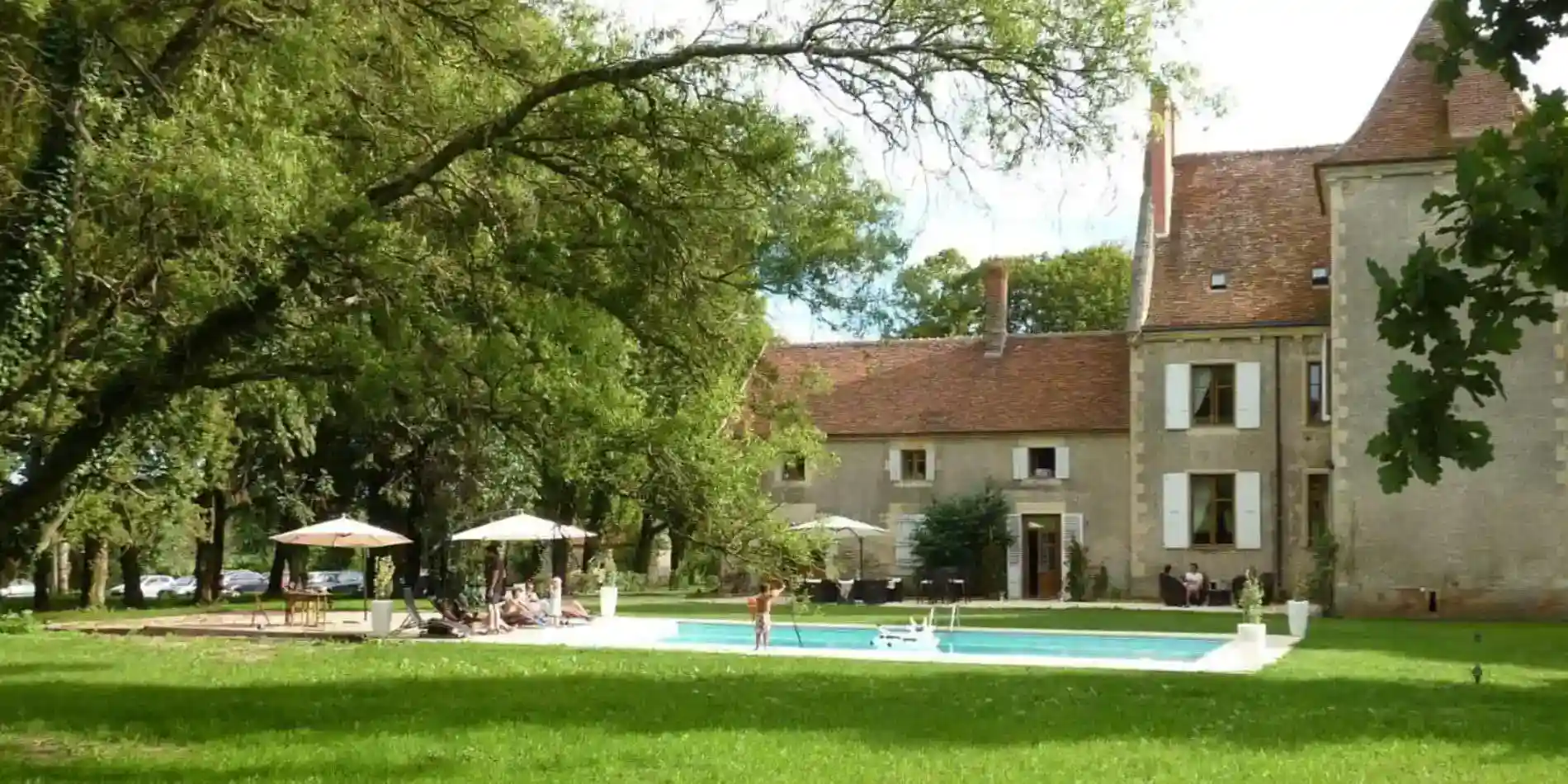 Luxurious historic European school with lush garden and swimming pool, ideal for international students and academic excellence.