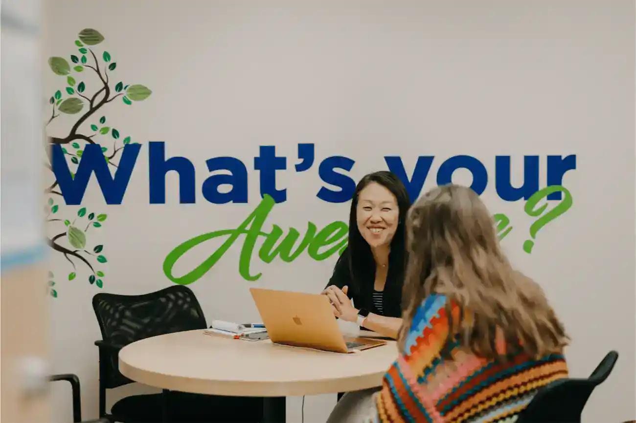 Bright students and educator engaging in a motivational conversation at World Schools.