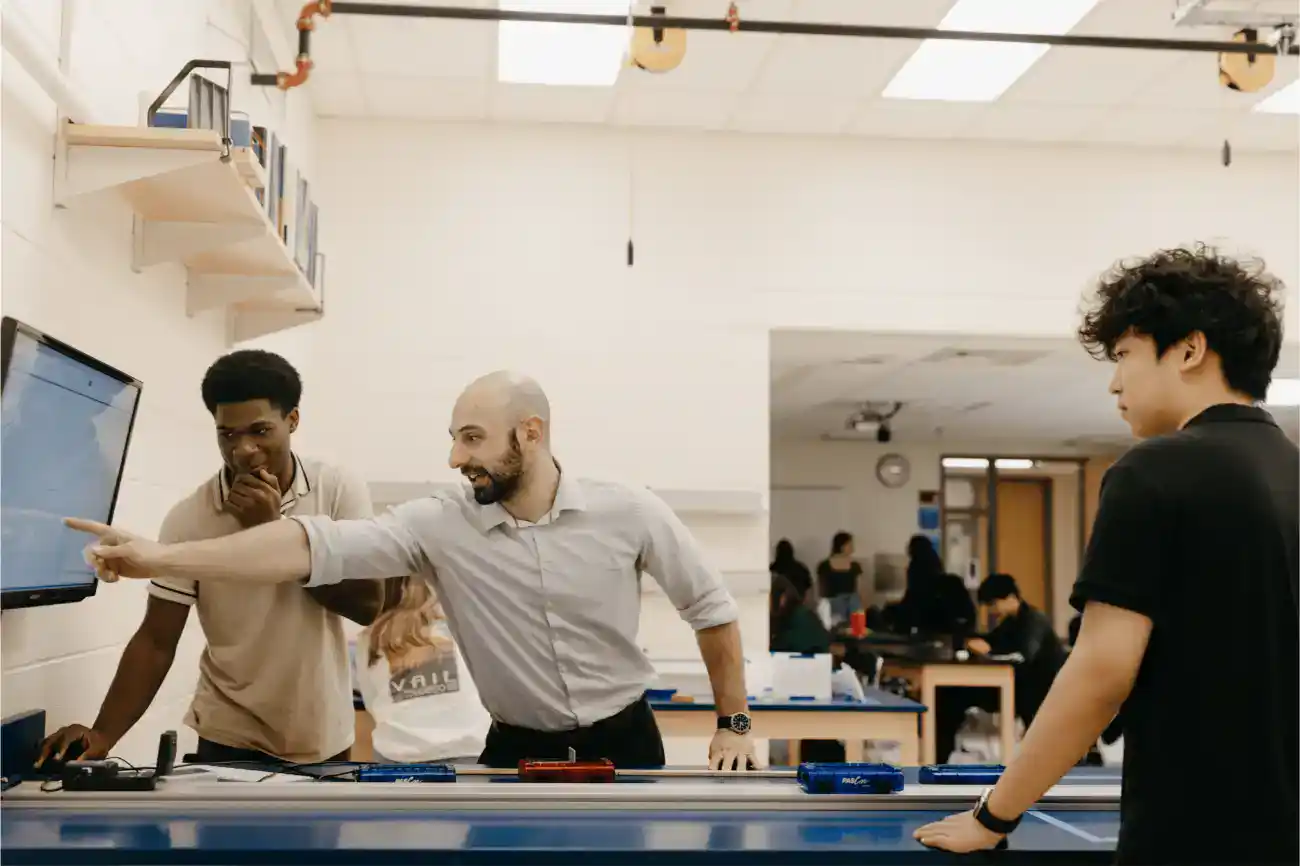 Innovative classroom with diverse students collaborating on STEM project at top World Schools.
