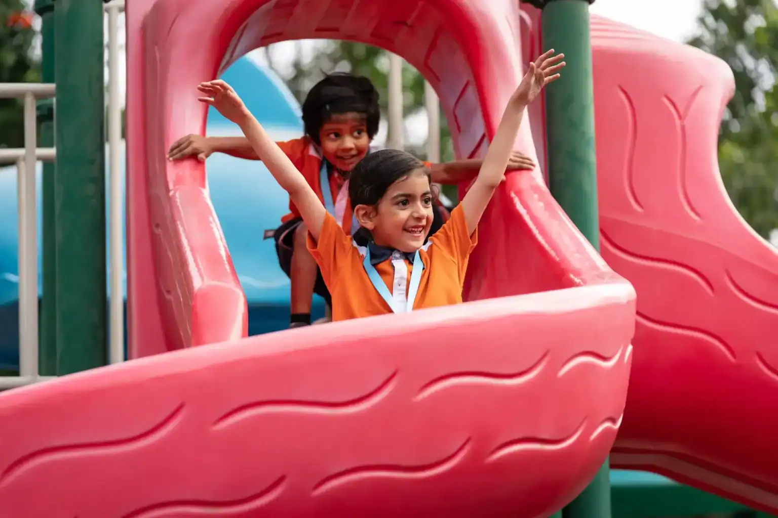 Girls enjoying play area at World Schools, promoting child development and teamwork.