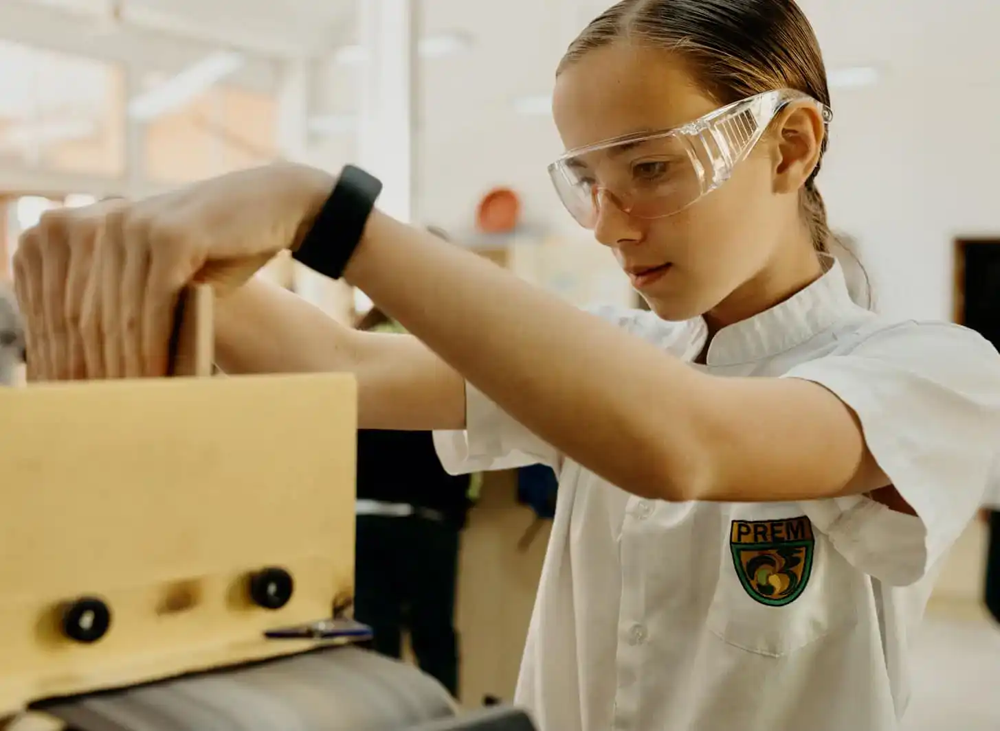 Innovative world school student engaging in STEM project, emphasizing leadership and academic excellence.