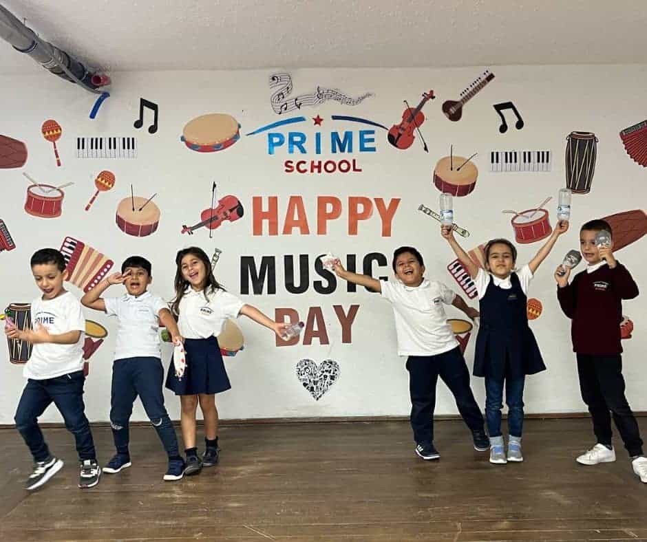 Kids celebrating Music Day at Prime School, enjoying musical instruments and joyful performances.