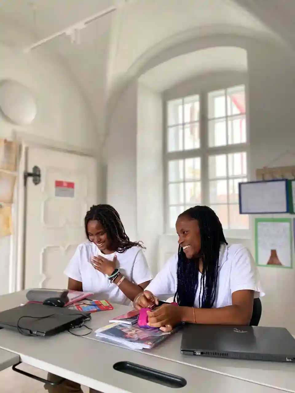 Happy students studying together at World Schools, fostering inclusive, innovative education environments.