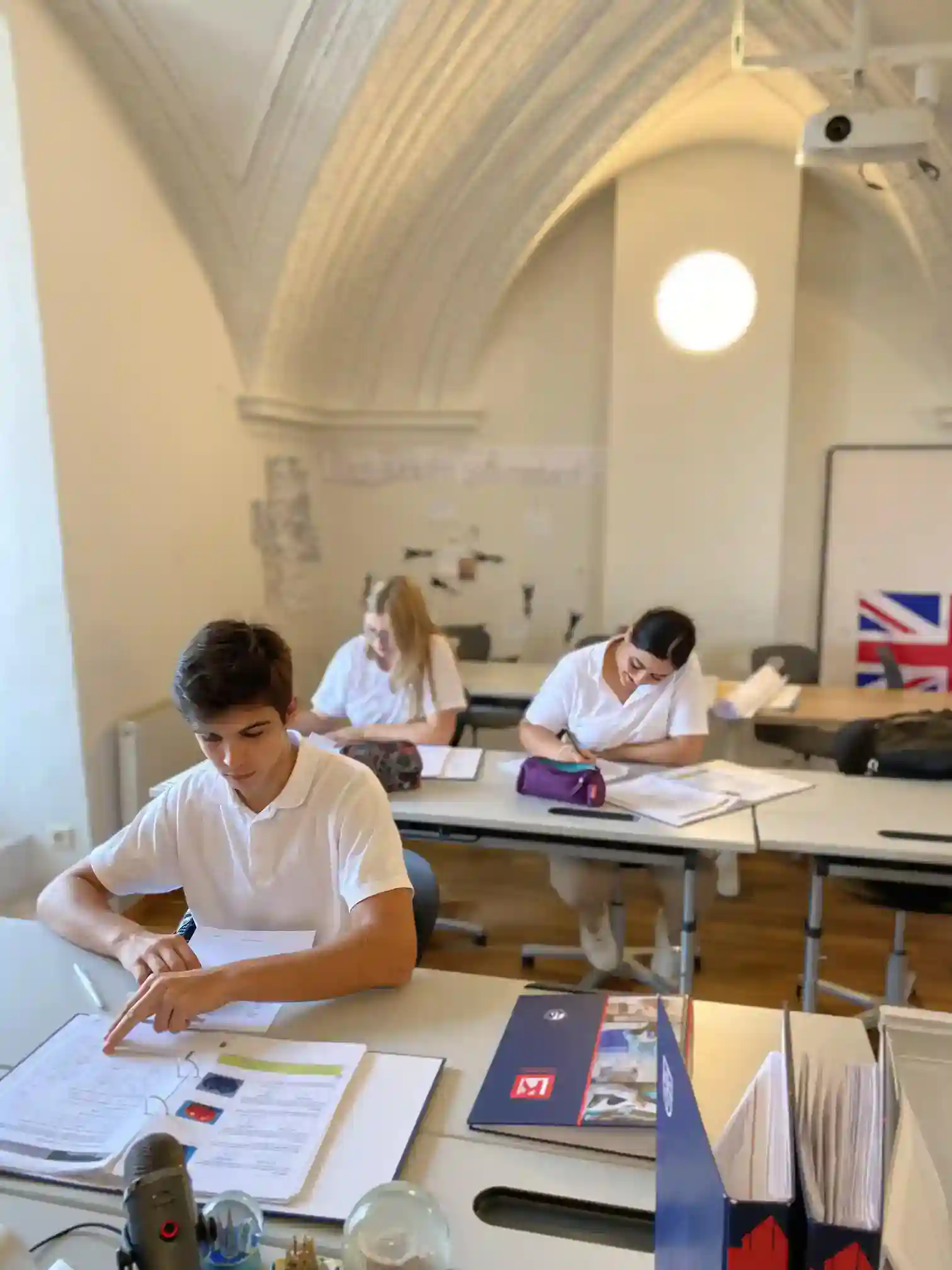 Students studying in a modern classroom at World Schools, focusing on innovative education for global learners.