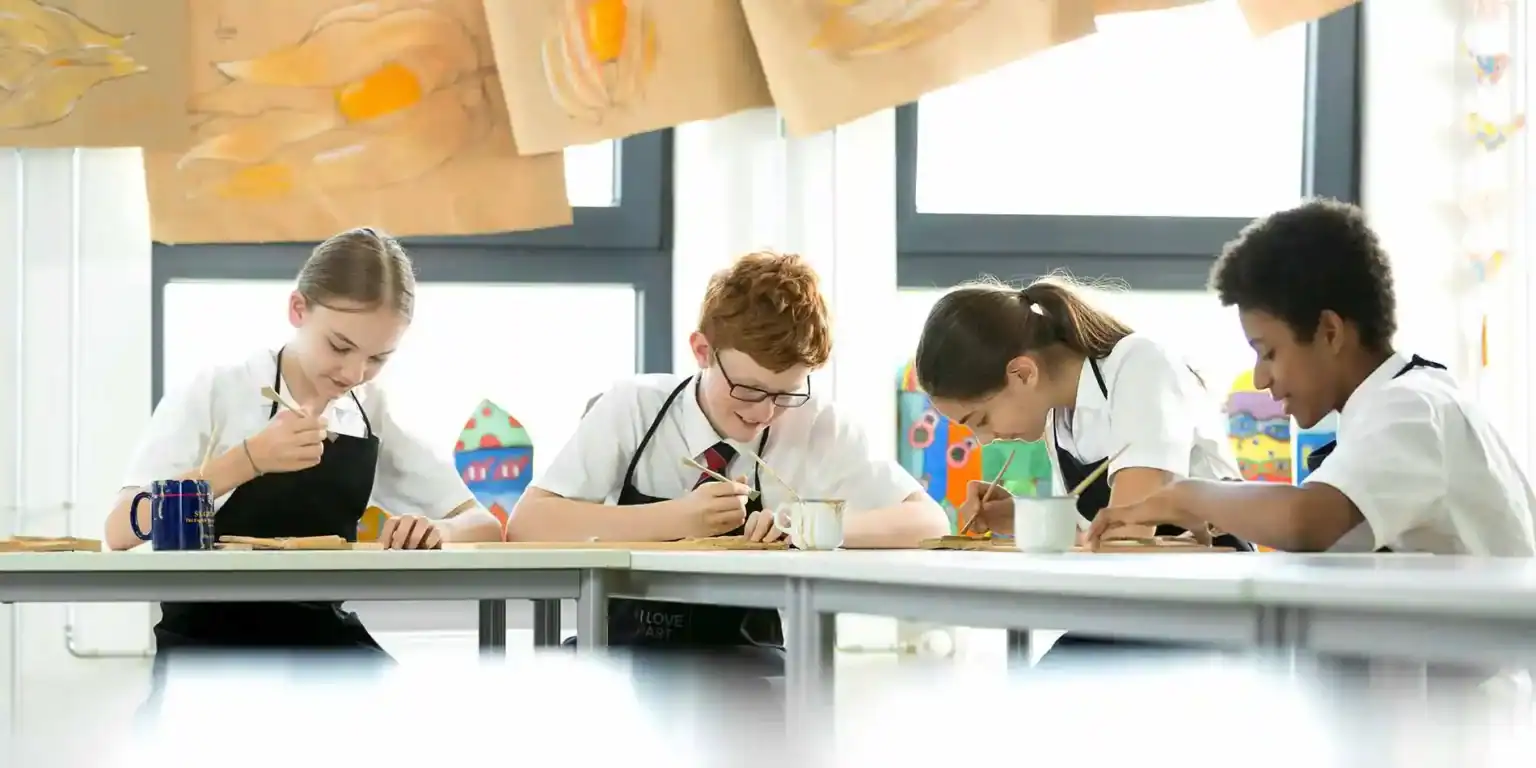 Children engaged in art activities at a schools, showcasing creativity and learning environments.