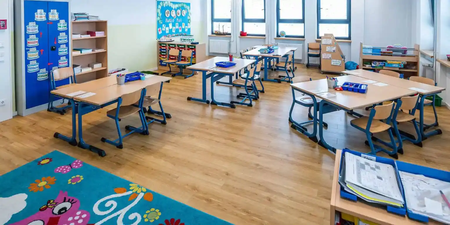 Bright classroom at World Schools with student desks, colorful decor, and educational materials for young learners.