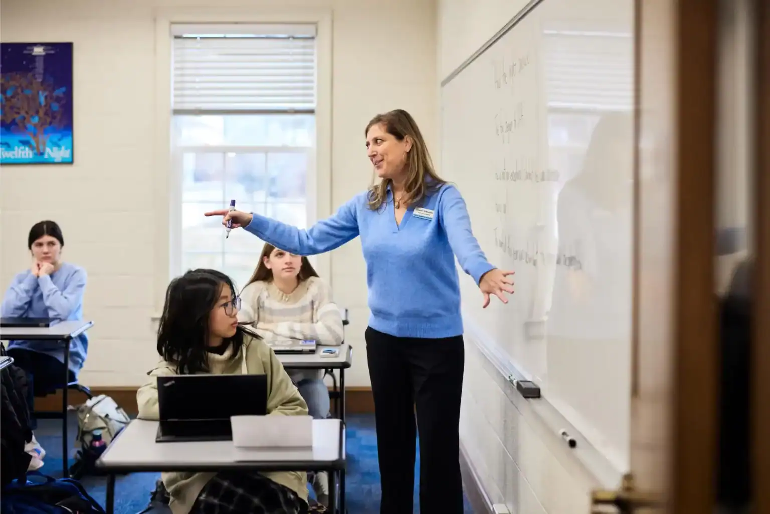 Engaging classroom with teacher and students, promoting global education at world schools for advanced learning.