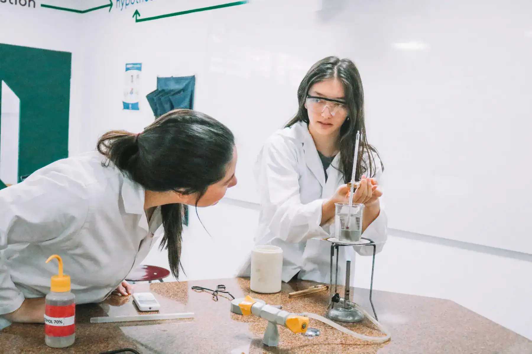 Students conducting science experiments in a modern classroom at World Schools, highlighting innovative education programs.