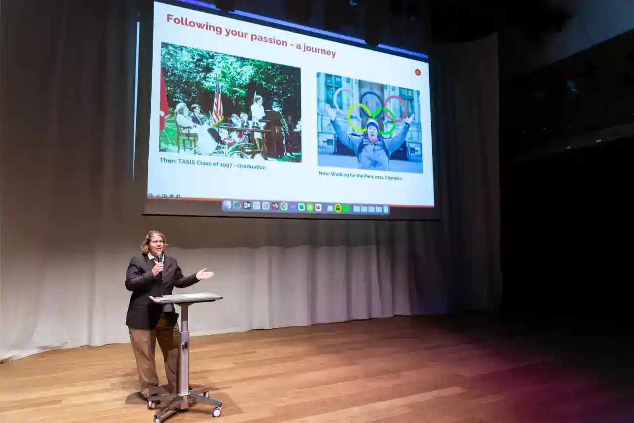 This Year at TASIS: 2023 1 Diverse student speaker presenting at educational conference, highlighting global school achievements and Olympic aspirations.