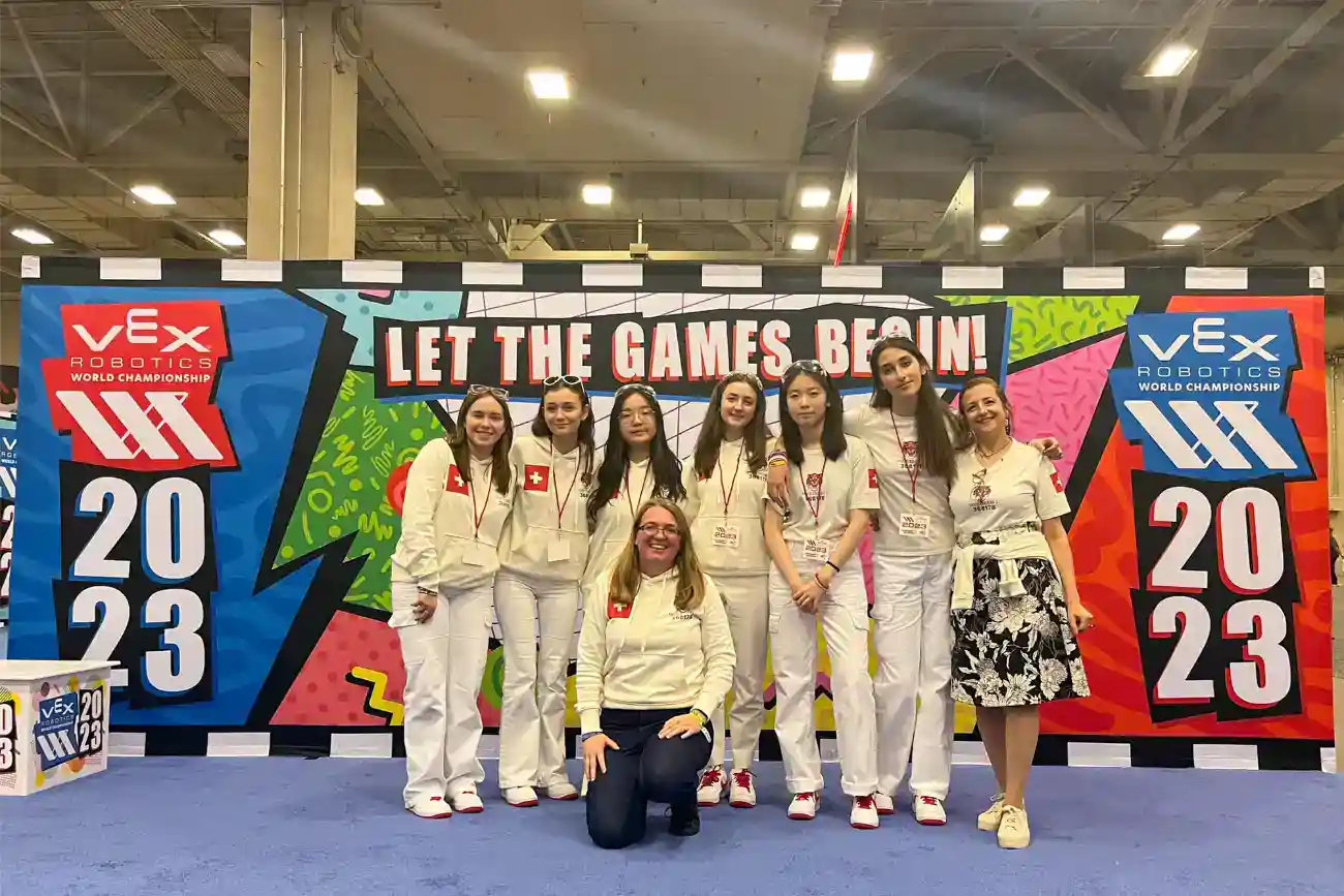 This Year at TASIS: 2023 13 VEX Robotics World Championship 2023 team posing at the event.