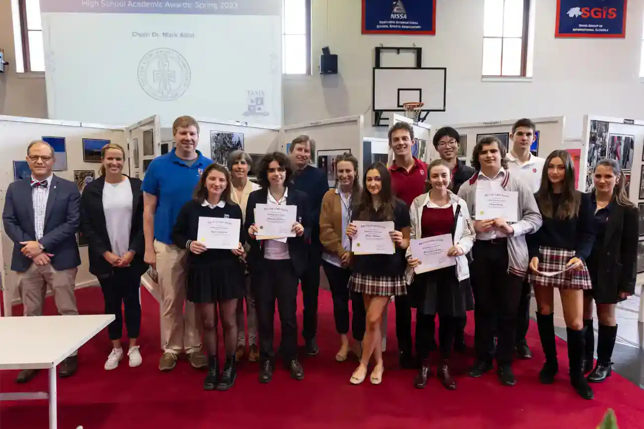 This Year at TASIS: 2023 15 Award ceremony at a prestigious international school conference, showcasing students and educators celebrating academic achievement.