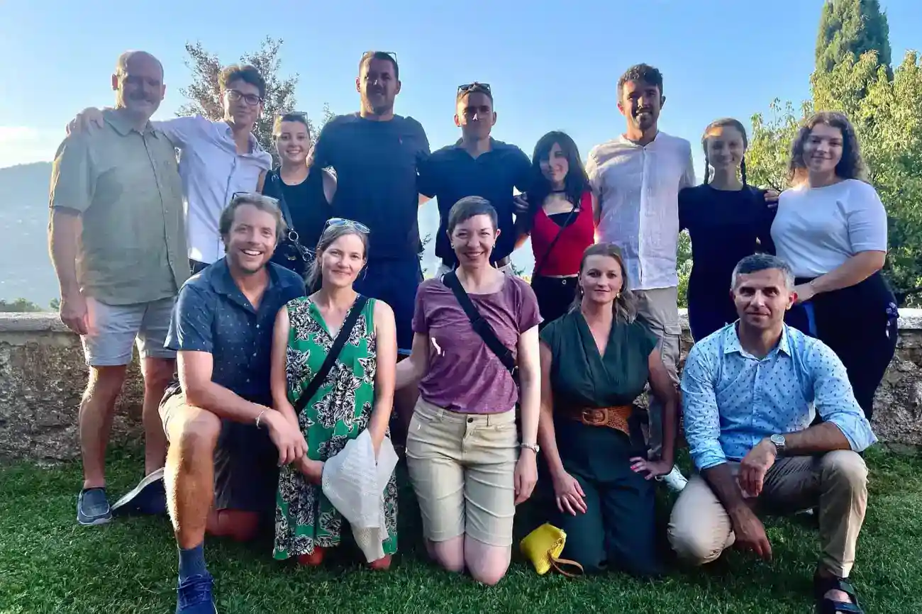 This Year at TASIS: 2023 32 Shared group of teachers and staff from World Schools during an outdoor team-building event, showcasing collaboration and community spirit.