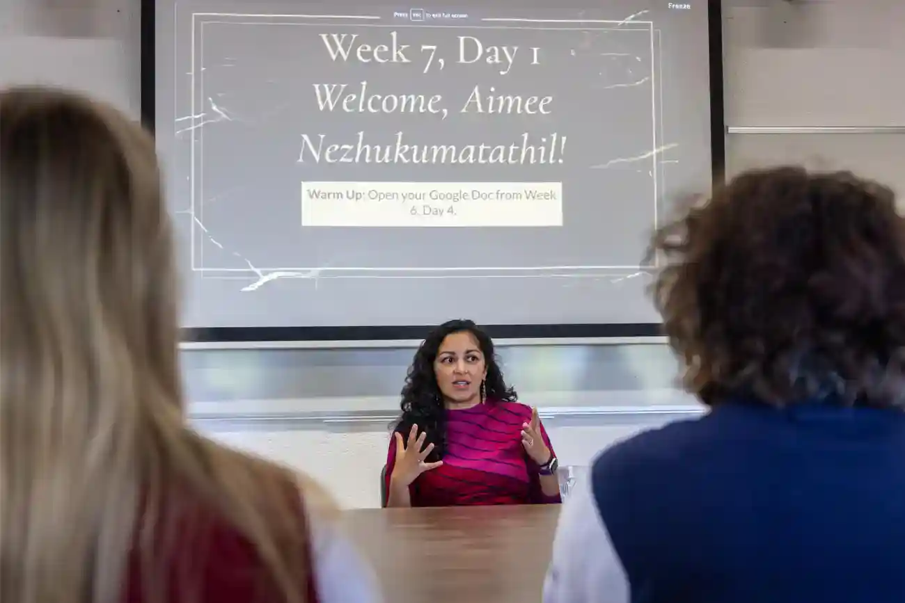 This Year at TASIS: 2023 39 English teacher explaining class schedule at World Schools, promoting international education and global learning.