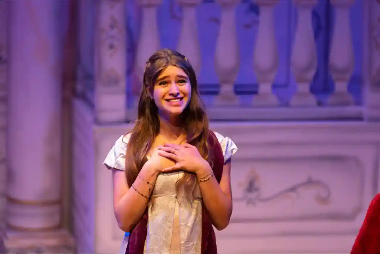 This Year at TASIS: 2023 5 Young girl performing in a school theatrical play, showcasing talent at a prestigious World School.