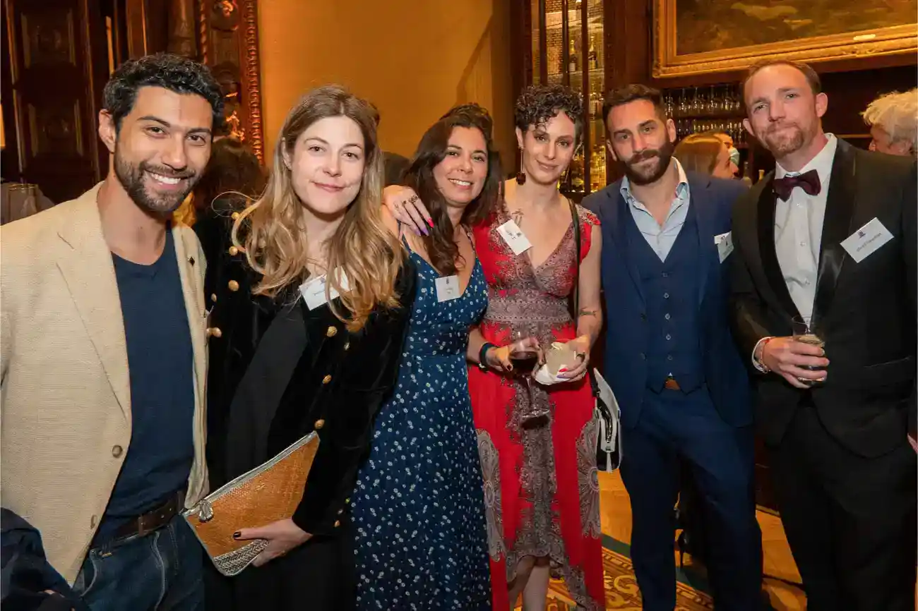 This Year at TASIS: 2023 7 Diversity of professionals at a networking event celebrating international education and global schools.