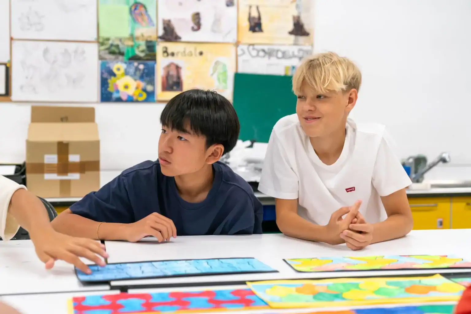 Young students engaged in a classroom activity at World Schools, promoting innovative education and international learning.