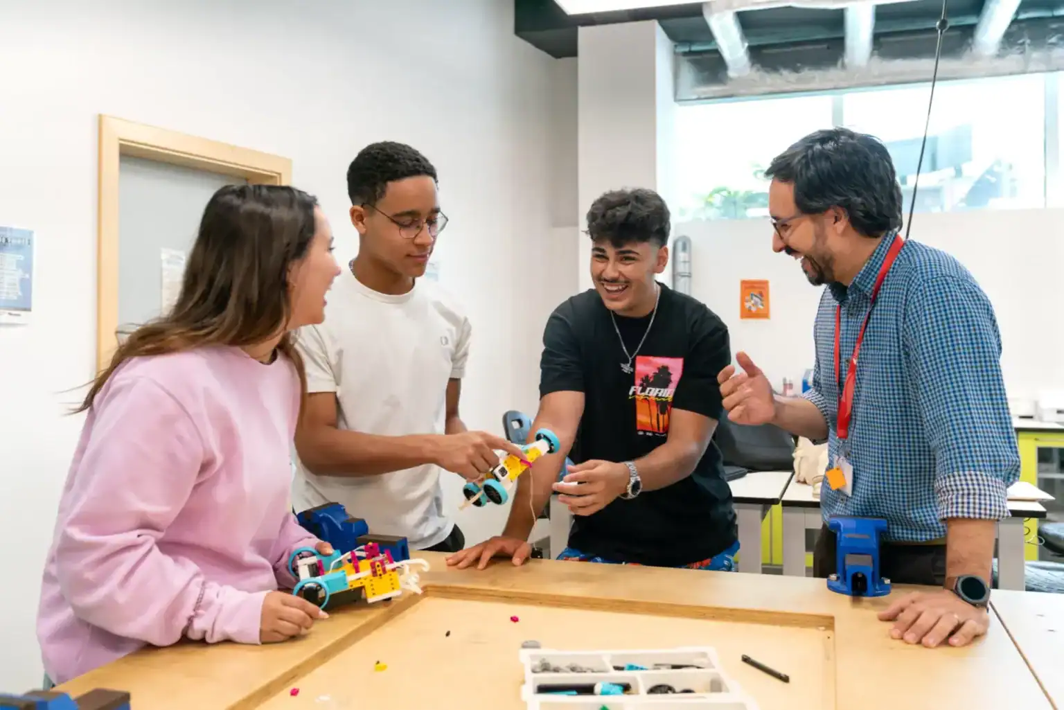 Robotics STEM education with diverse students collaborating on innovative projects at World Schools.