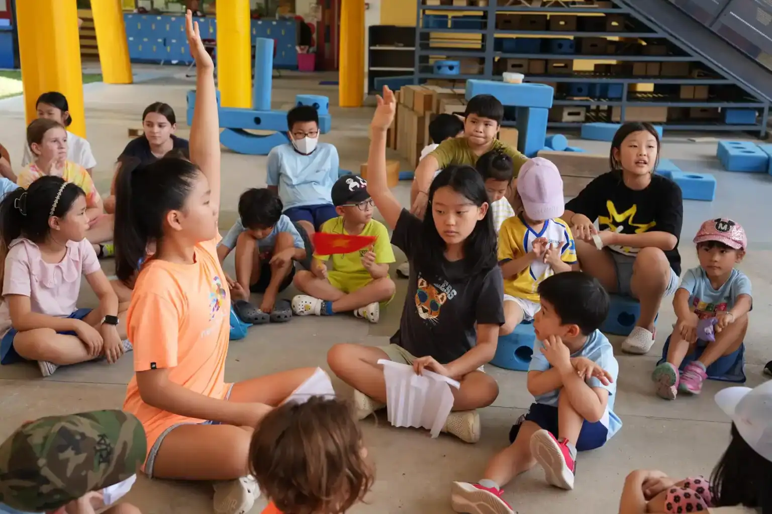 Children participating in classroom discussion at World Schools international school.
