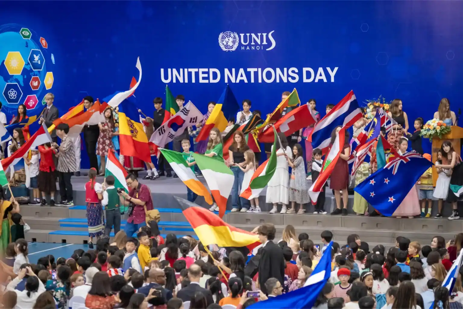 Colorful flags from around the world at a United Nations Day celebration at UNIS Hanoi, promoting global unity and cultural diversity.