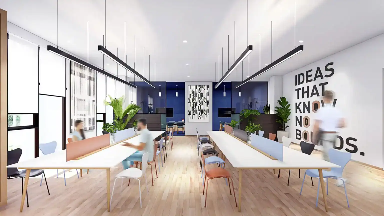 Bright modern student collaboration space with study desks, plants, and motivational wall message.