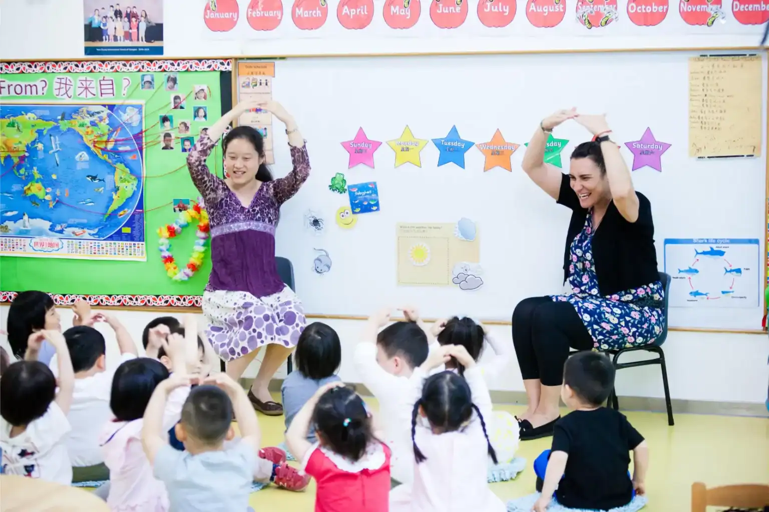 Interactive classroom with young students and teachers engaging in fun learning activities at a world school.