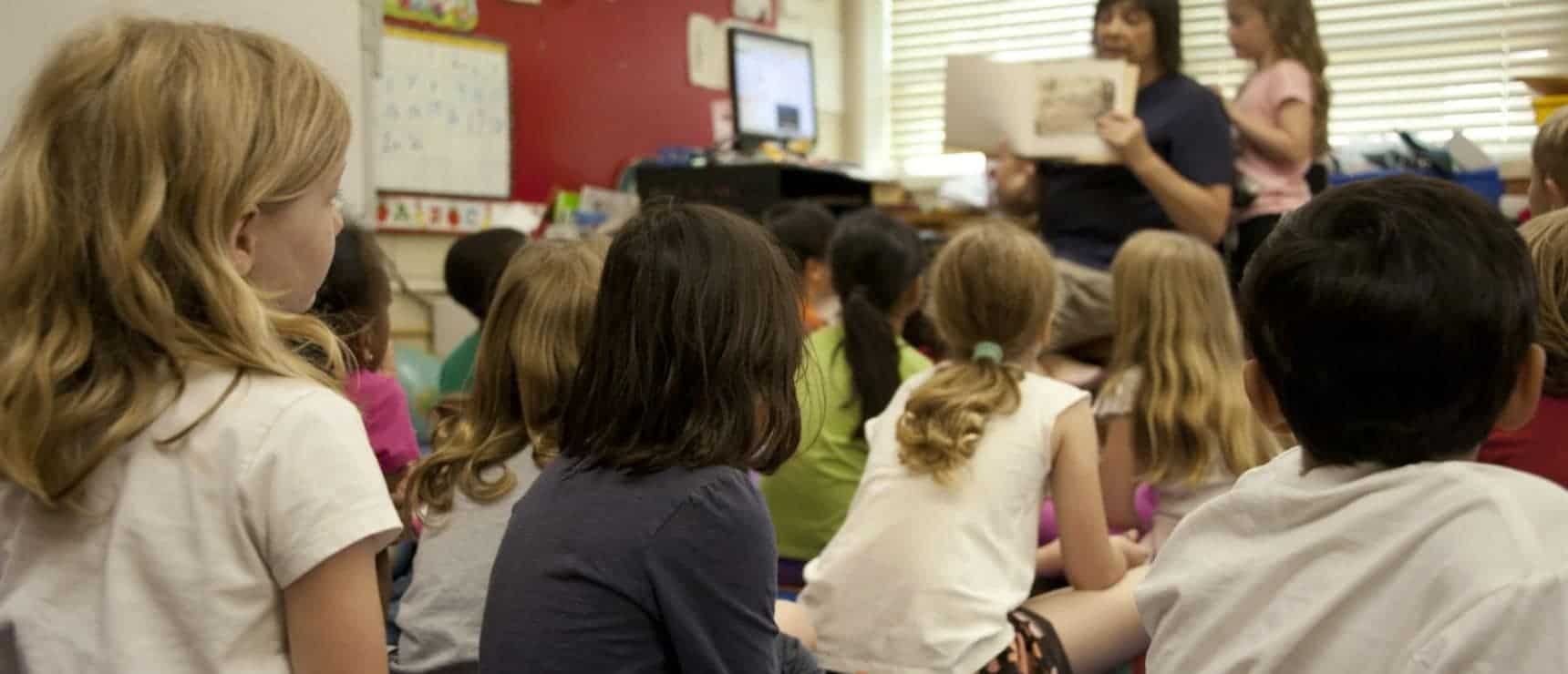 Students attentively participating in a classroom activity at a world school.
