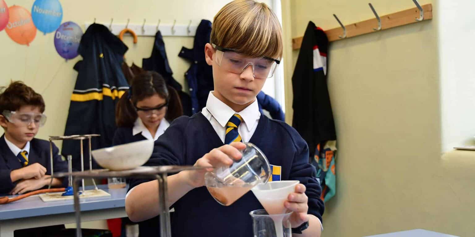 Innovative school students conducting science experiments in a classroom.