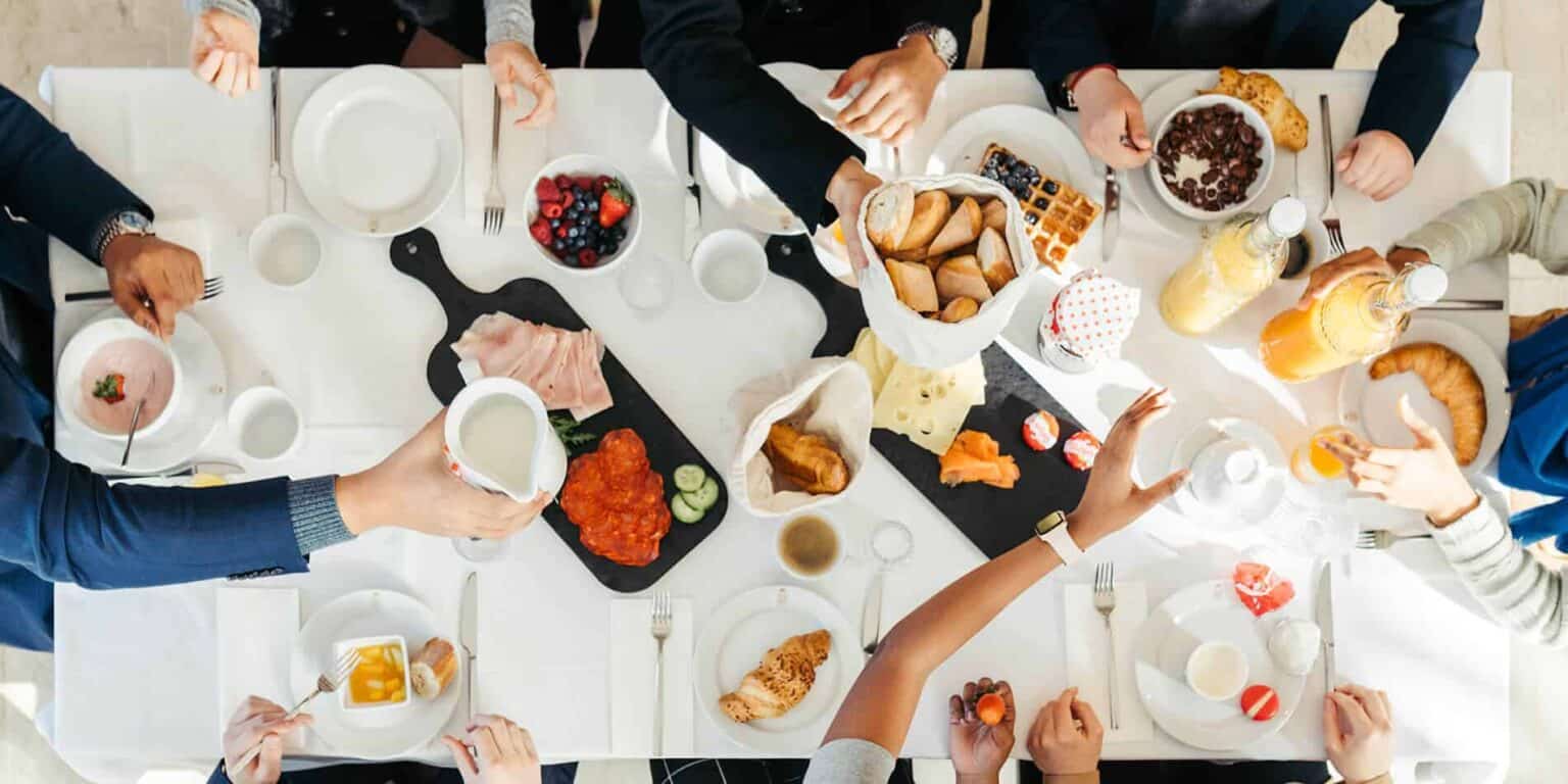 Delicious breakfast spread with diverse food options at a school event, promoting healthy eating and social interaction.