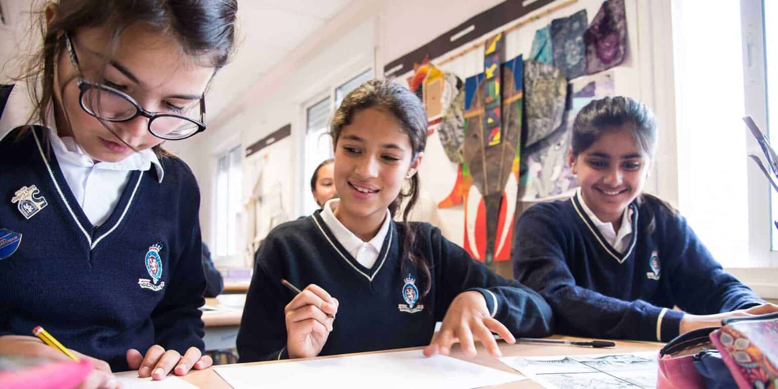 Students engaged in creative learning at a World Schools classroom, fostering global education and multicultural collaboration.