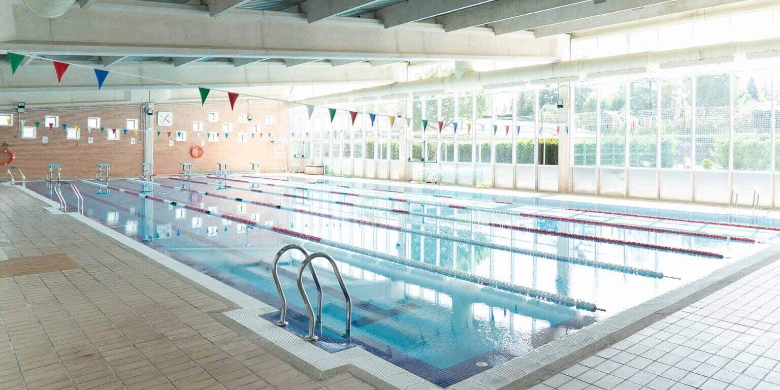 Modern indoor swimming pool at an international school, great facilities for student athletes and swimming lessons.