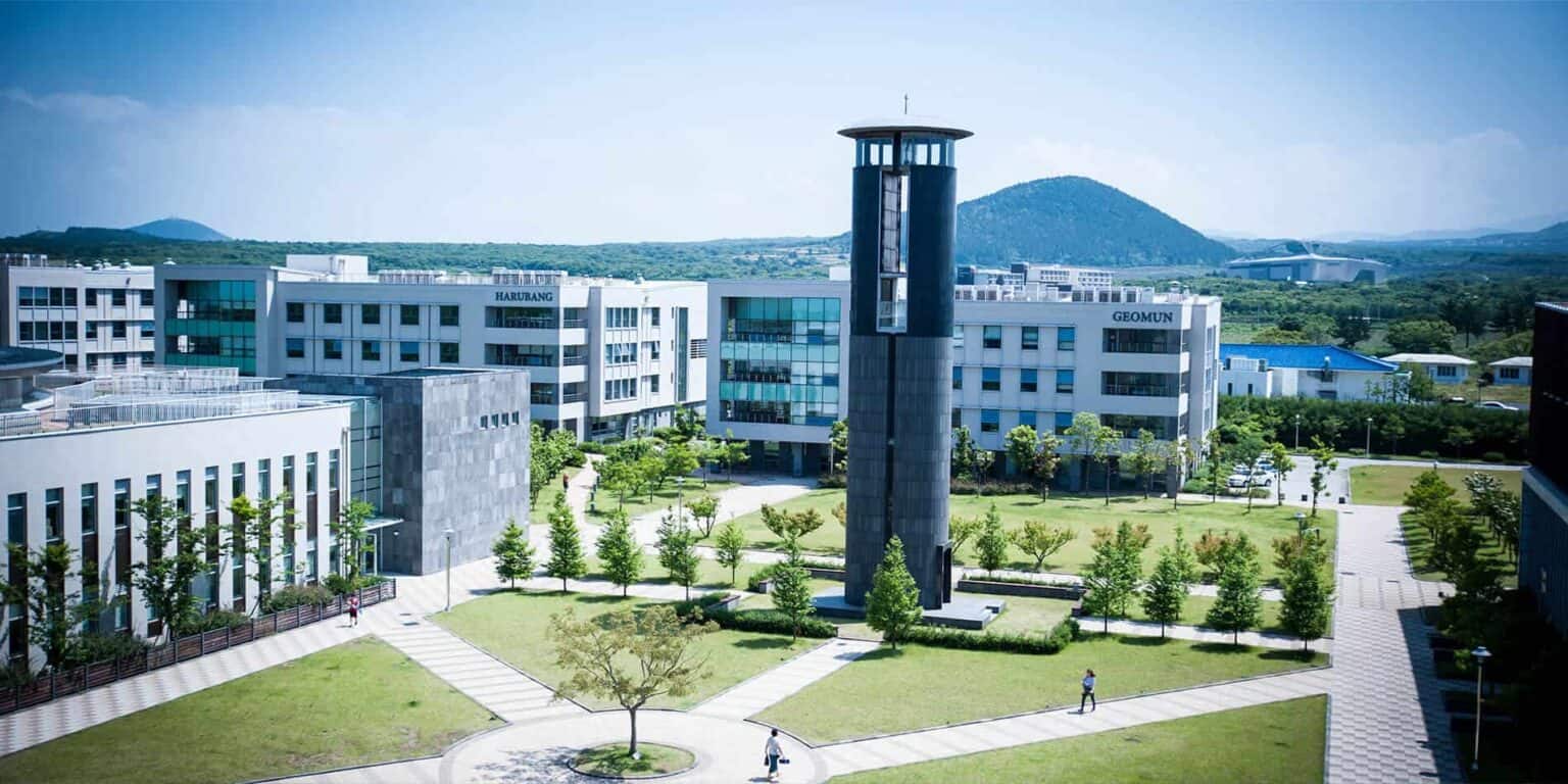 Modern international school campus with contemporary buildings and lush green outdoor spaces, ideal for global student communities.