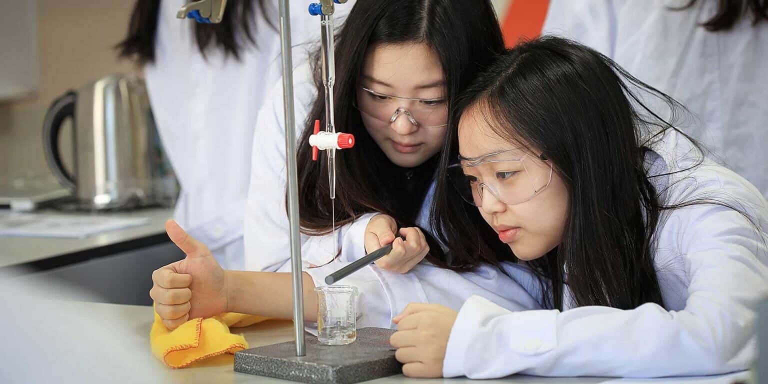 Innovative science students conducting lab experiments at a prestigious World Schools science program.
