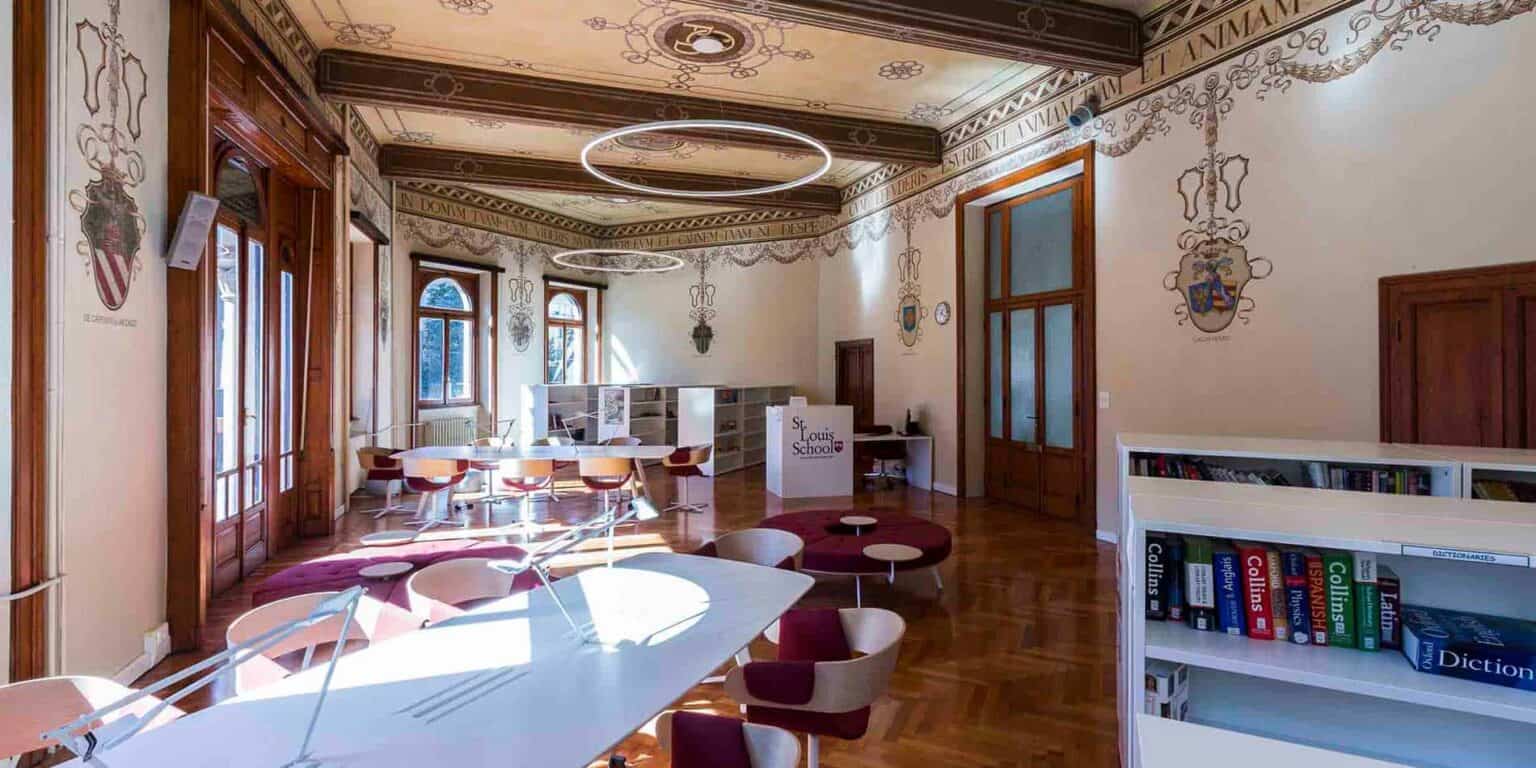 Bright, modern school library with wooden accents, large windows, and educational decor – ideal for learning.