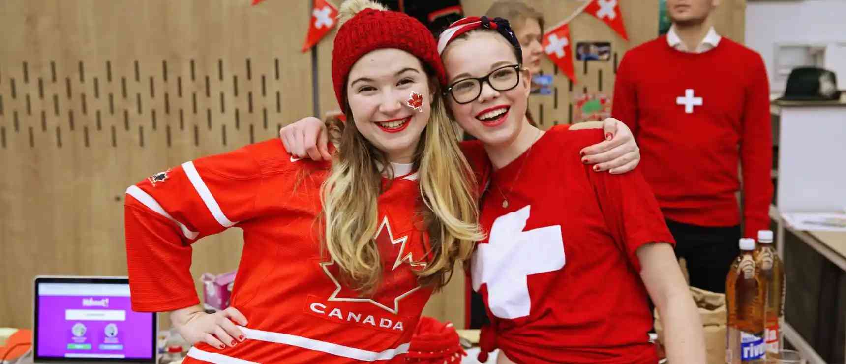 Brightly dressed students celebrating Canadian National Day at an international school event.