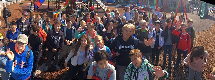 Students enjoying outdoor activities at a school playground for opportune learning environments.