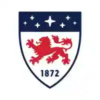 Red lion crest with shield and stars, established 1872, representing world-class education.