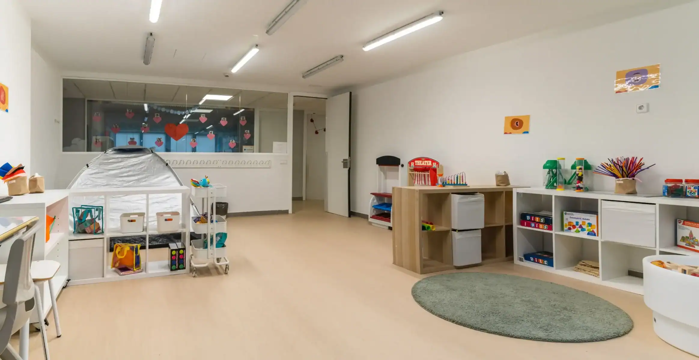 Bright and organized classroom at Liceo Europeo with educational toys and learning materials.
