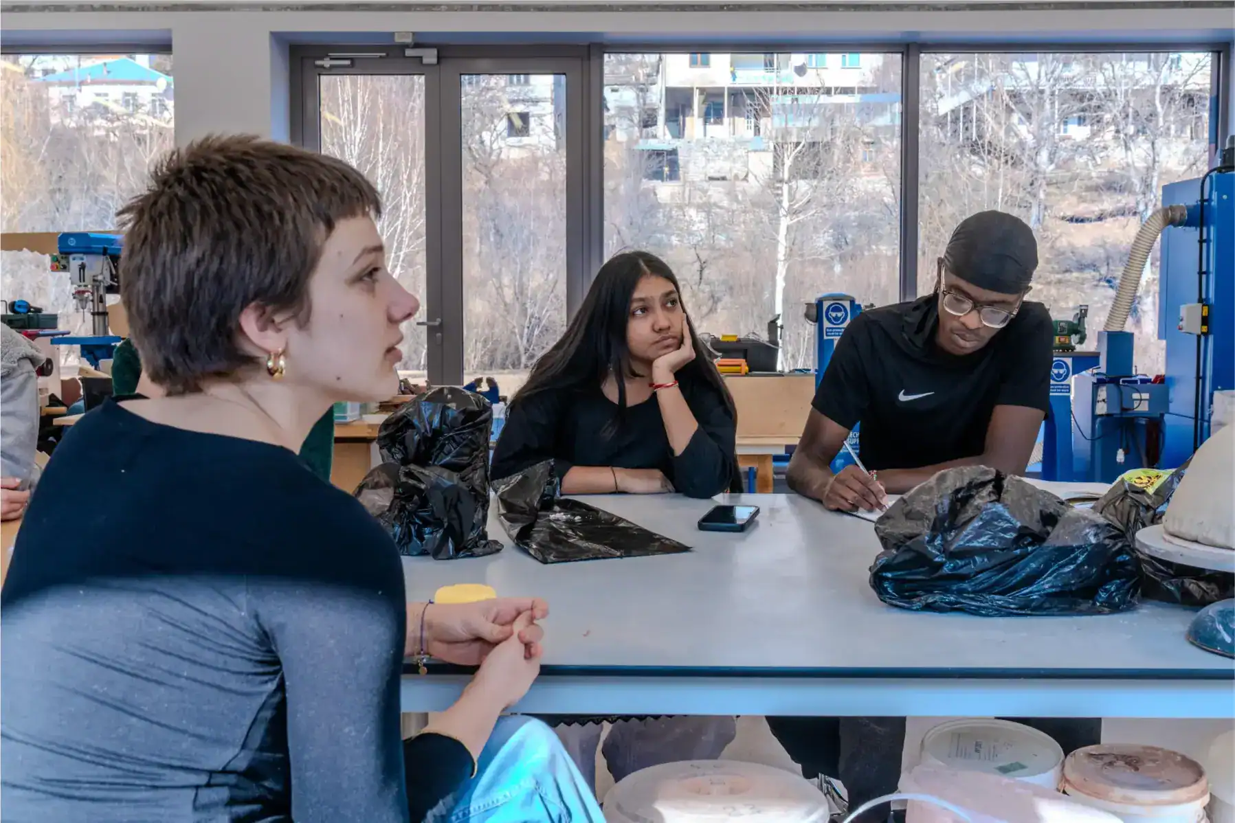 Innovative classroom with diverse students engaging in hands-on science activities at a modern school.
