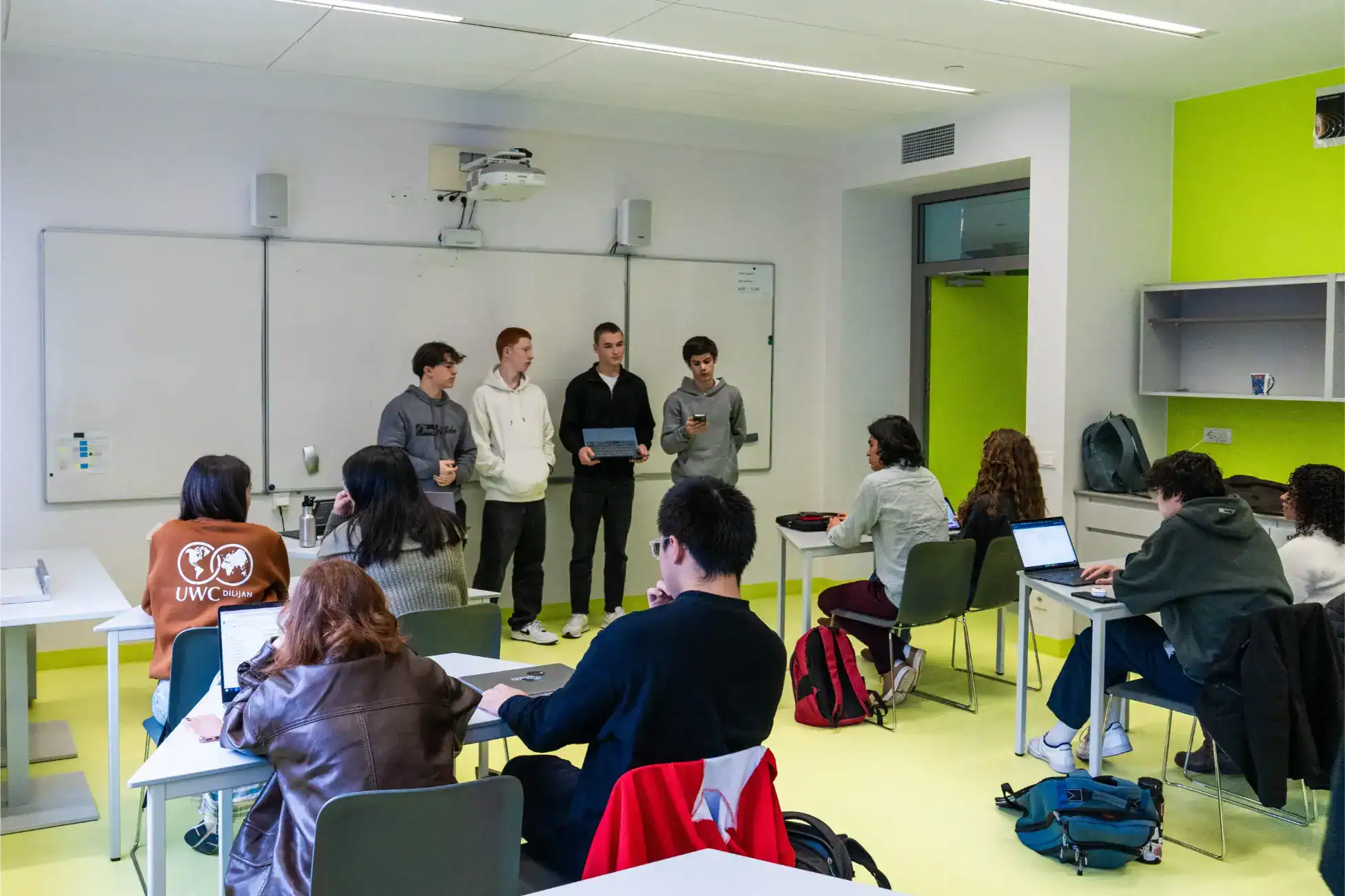 Advanced international school classroom scene with diverse students presenting and engaging in learning activities.