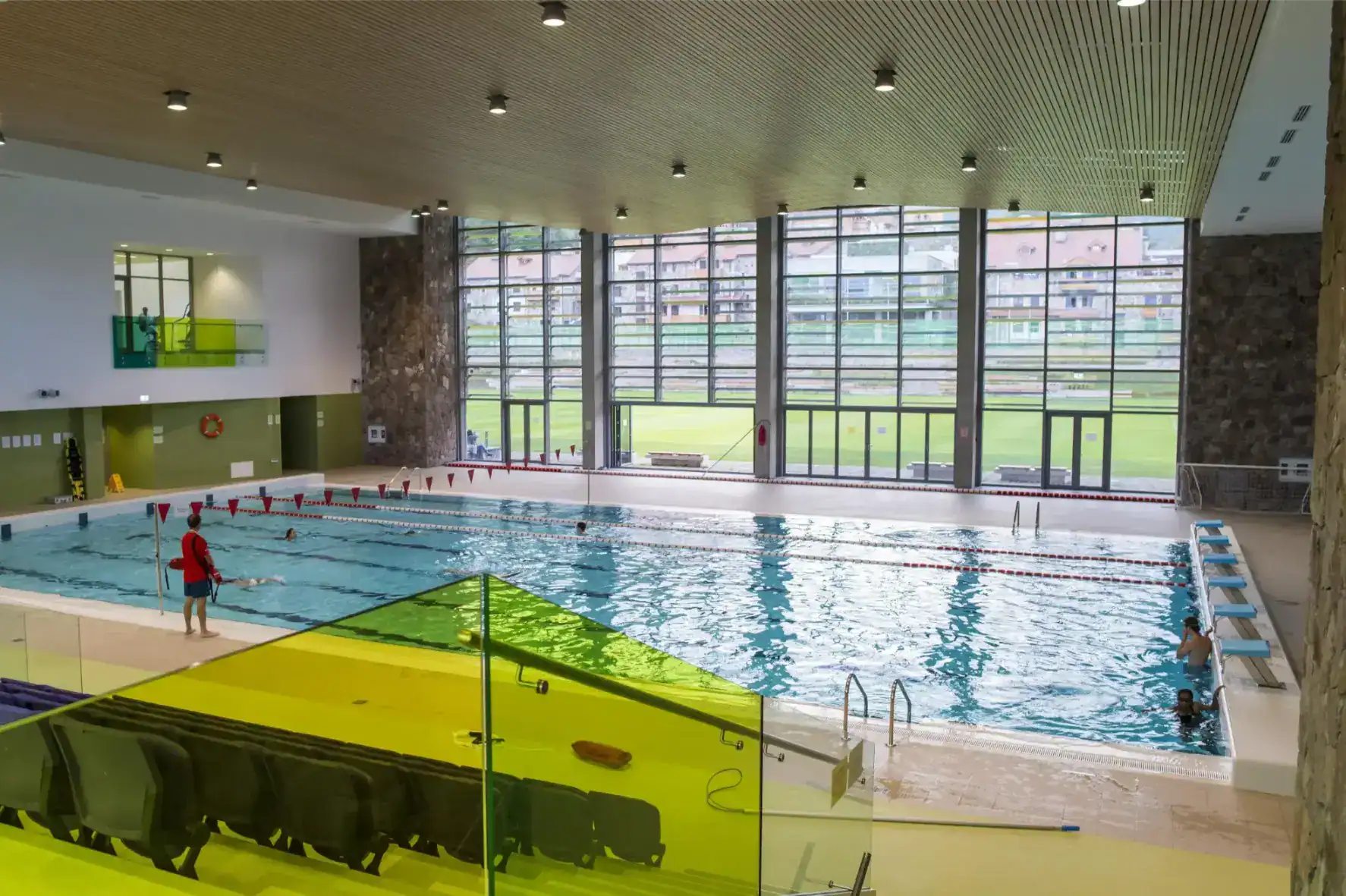Modern indoor swimming pool at an international school, offering sports facilities for students' development.