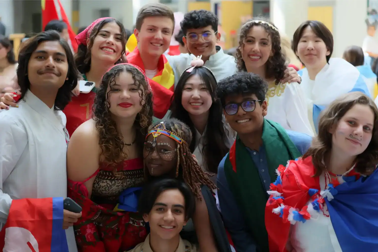 Diverse group of students celebrating cultural diversity at a World Schools event.