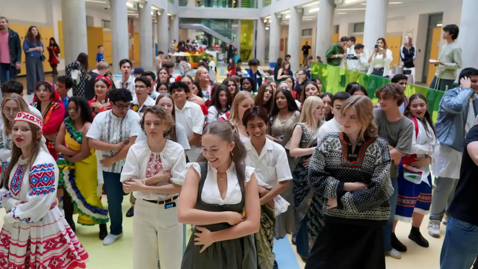 Diversity of students celebrating cultural events in a modern school atrium, promoting global education and inclusivity.
