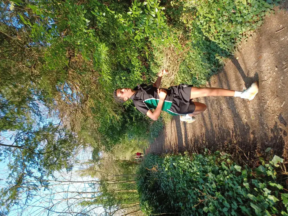 Student walking on a nature trail at RGS Surrey Hills school.