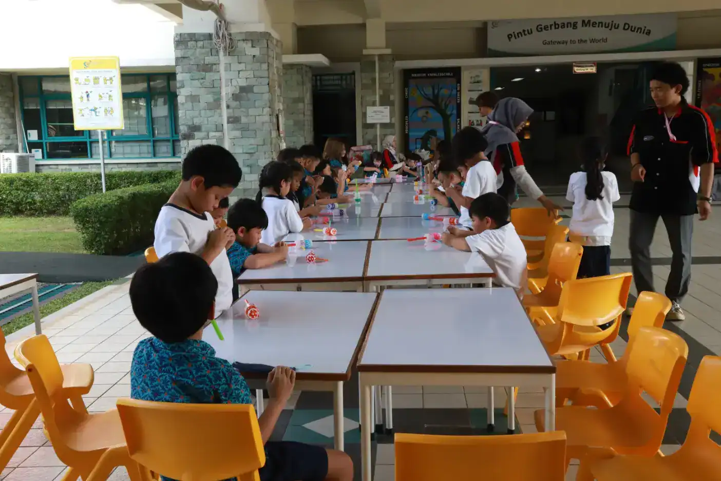Kids participate in outdoor educational activities at a World Schools campus.