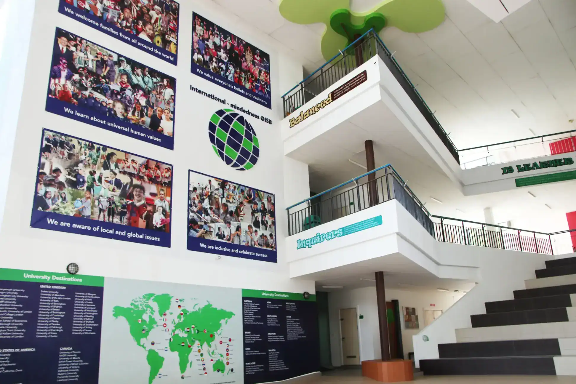 International school hall with global education displays and colorful posters highlighting world values and university destinations.